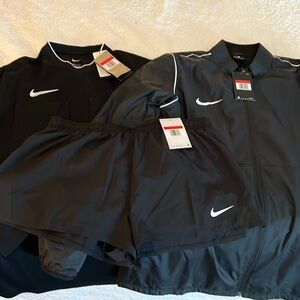 Random Nike lot. Referee shirt, jacket, and shorts new with tags.